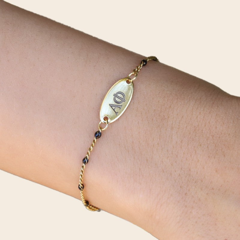 Alpha Phi Sorority Bracelet – Black Enamel Gold-Plated Chain Style, Modeled on Hand