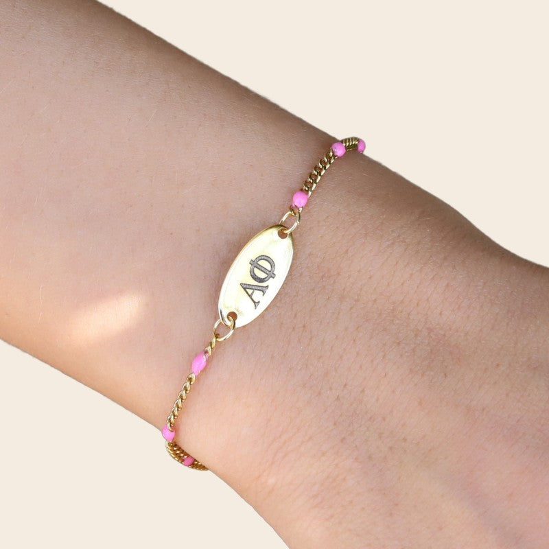 Alpha Phi Sorority Bracelet – Pink Enamel Gold-Plated Chain Style, Modeled on Hand