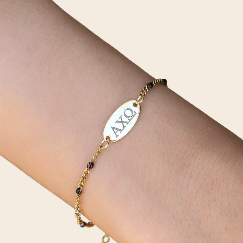 Alpha Chi Omega Sorority Bracelet – Black Enamel Gold-Plated Chain Style, Modeled on Hand