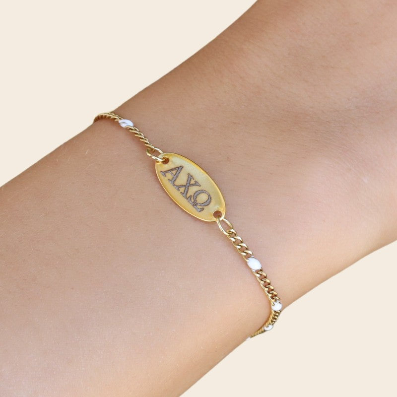 Alpha Chi Omega Sorority Bracelet – White Enamel Gold-Plated Chain Style, Modeled on Hand