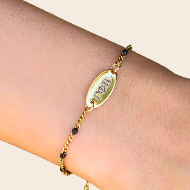 Gamma Phi Beta Sorority Bracelet – Black Enamel Gold-Plated Chain Style, Modeled on Hand